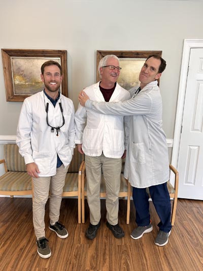 Three Wrightsville Dental dentists standing together in the office